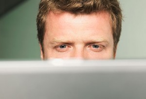 getty_rf_photo_of_man_straining_eyes_at_computer