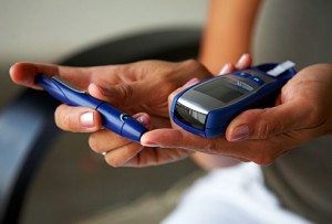 getty_rf_photo_of_woman_checking_glucose