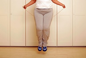 getty_rf_photo_of_woman_jumping_rope